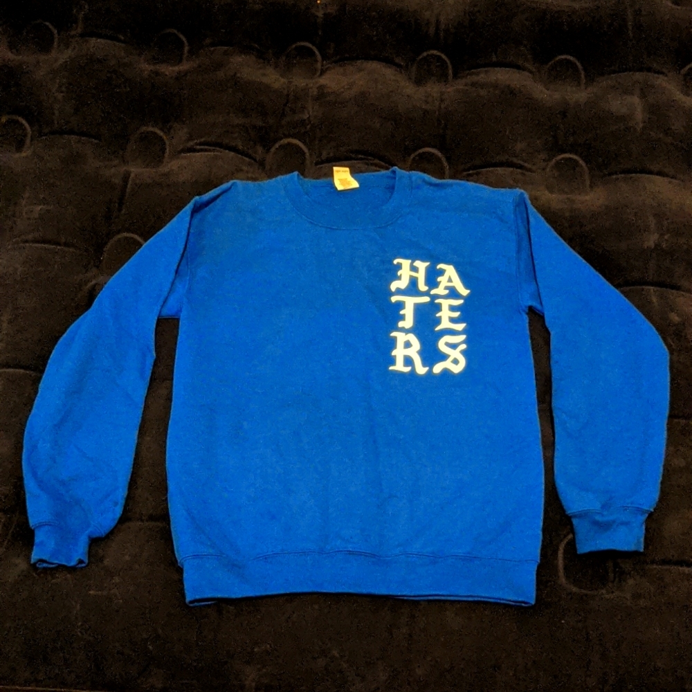 Small blue "Pray for my haters" crewneck with praying skeleton hands. Gildan.